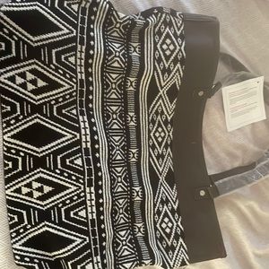 Brand new thirty one bag still has wrapped handles